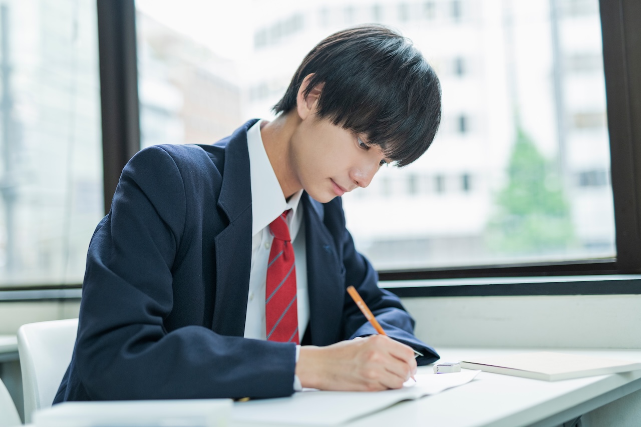 Workspace with laptop, notebooks, and stationery